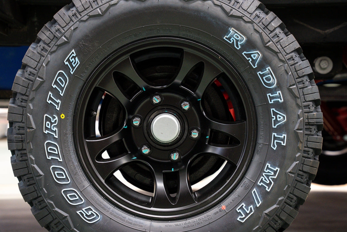 off-road trailer tire mounted on a Black Series HQ camper