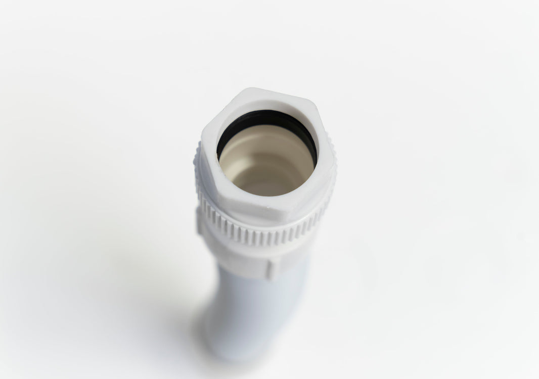 Flexible drain pipe under an RV outdoor kitchen sink cabinet