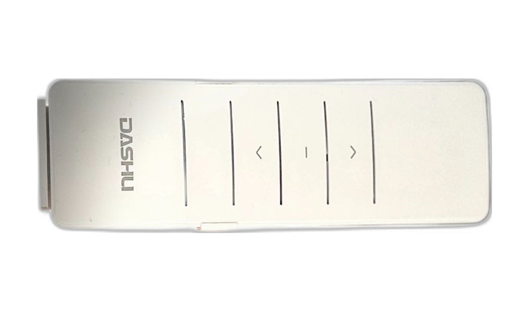 Black Series awning remote control held near an RV