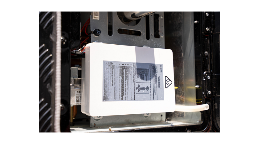 12V tankless water heater installed in an RV utility compartment