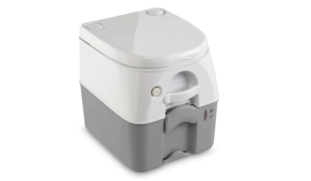 Dometic 5-gallon portable toilet set up beside an RV