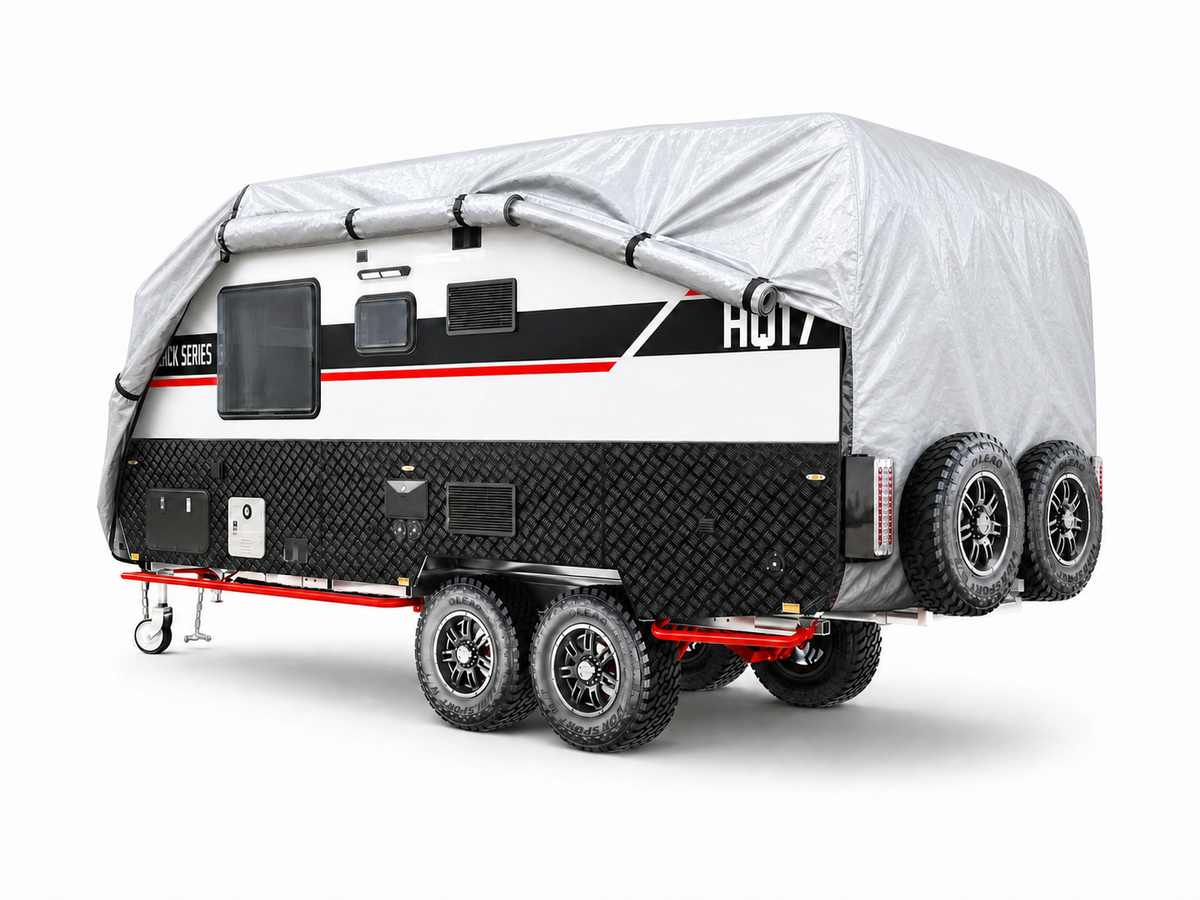 silver trailer cover fitted over a parked Black Series camper