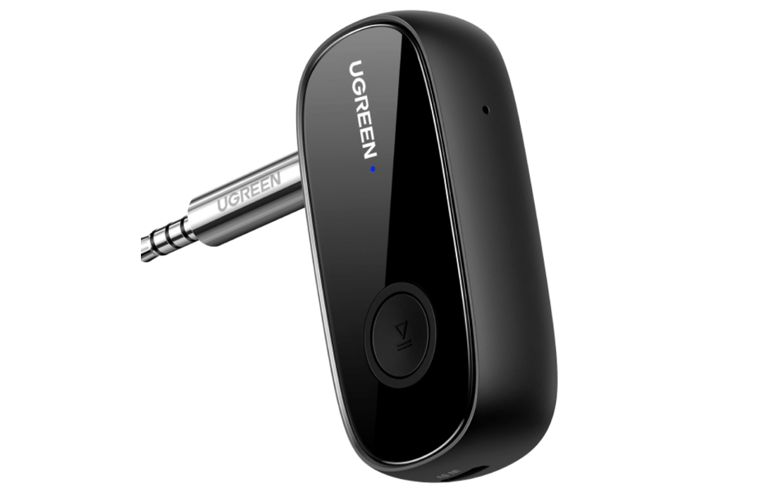 UGREEN Bluetooth AUX adapter plugged into an RV stereo input
