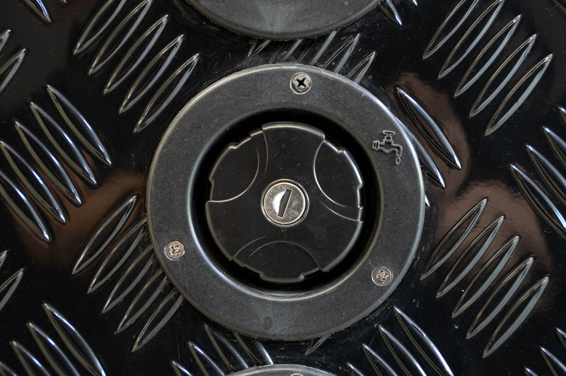 Black Series OEM water inlet installed on checker plate camper panel