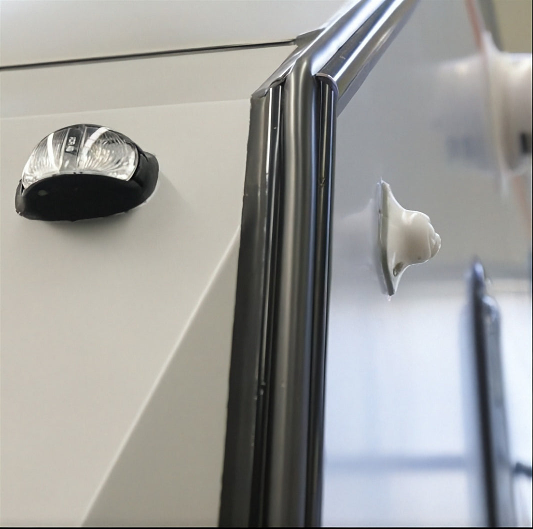 Black rubber edge trim along Black Series camper body corner