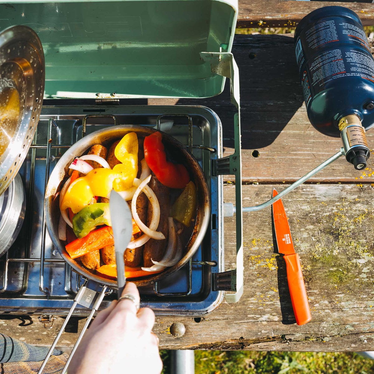Ignik TapRack refilling device with four blue refillable propane bottles
